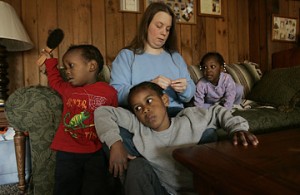White mother with three adopted Black children